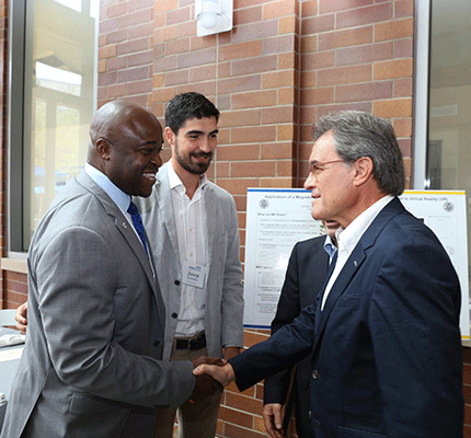 Dean Gregory Washington greets the guest of honor, former Catalonian president Artur Mas at the Balsells event