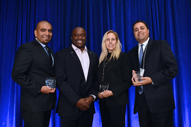 This year's Samueli School Hall of Fame inductees include, from left, Robert Sanchez, Cindy Miller and Hany Haroun (with Dean Gregory Washington, second from left). Not pictured: Daryoosh Vakhshoori. Photo: Carlos Puma