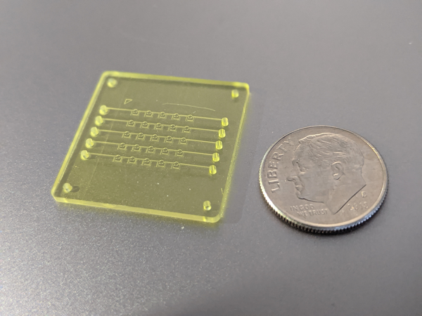 This 3D-printed piece, one of two in the team’s prototype, can run 25 tiny droplet reactions simultaneously. Each channel is approximately twice the width of a human hair, while each droplet’s volume is 200 times smaller than a human tear.