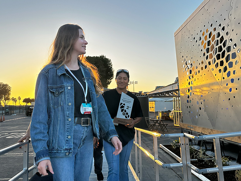UCI mechanical engineering senior Keeley Wandrocke (left) and others walk into the LuminOCity home after the team won second place in the OC Sustainability Decathlon. (Photo: Natalie Tso/UCI)