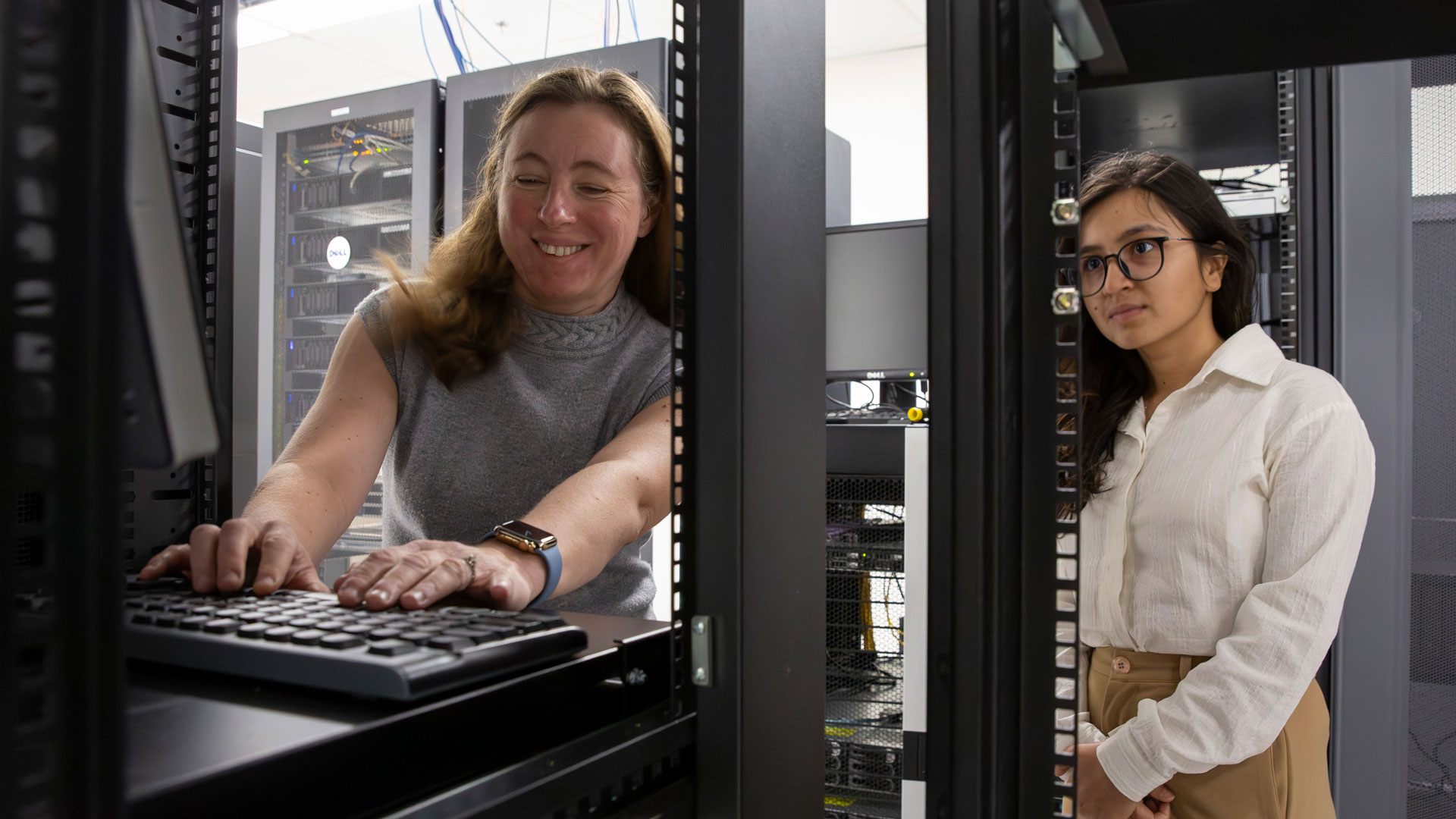 Arizona State University researcher Yulia Peet works with Anushka Subedi, a mechanical engineering doctoral student, in the university’s high-performance computing facilities. Peet leads a team of researchers from the University of California, Irvine and Brown University in a three-year, $2.25 million Air Force Office of Scientific Research project to study new uses of metamaterials for passive flow control in aerospace and defense applications. The project also seeks to develop a diverse workforce in the field. Photographer: Erika Gronek/ASU