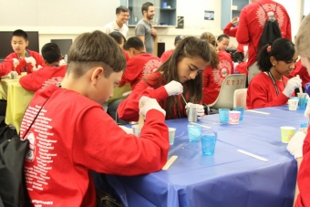 Middle schoolers make a 3-D mold of their thumbs at UCI's Rapidtech