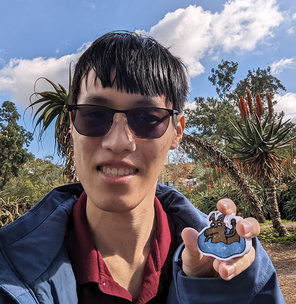 Biomedical engineering senior Vietbao Tran holds up his unique Petr stickers