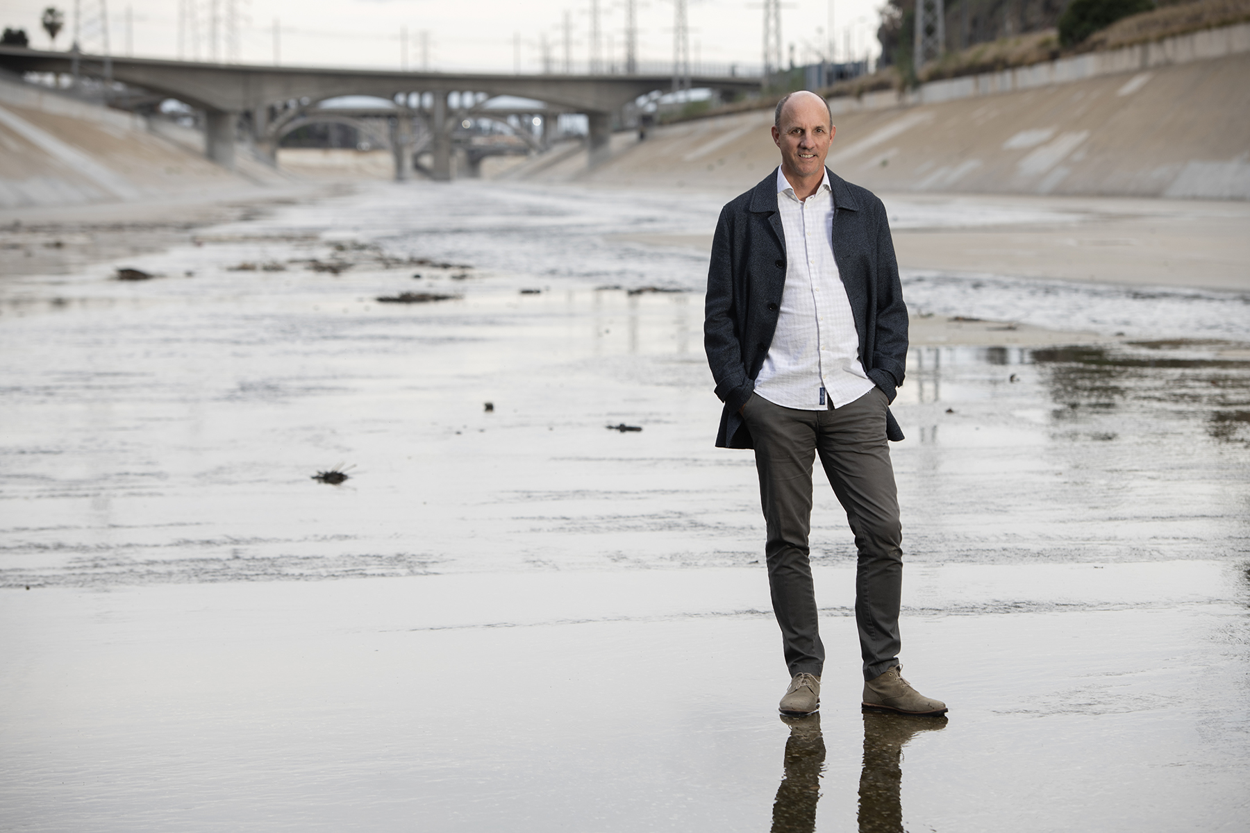 Professor Brett Sanders stands in the LA River