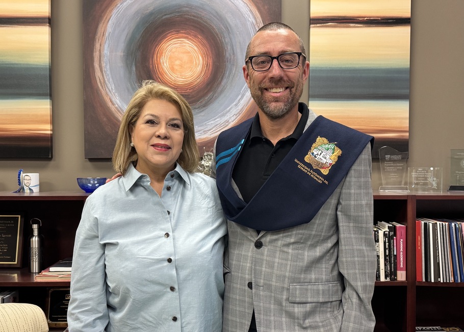 Mexico Graduate Research Education Program Director Luisa Kregel and Stacey Nicholas Dean of Engineering Magnus Egerstedt in the Dean’s Office. Dean Egerstedt is wearing the ceremonial “sash” signifying his induction as an International Honorary Faculty.