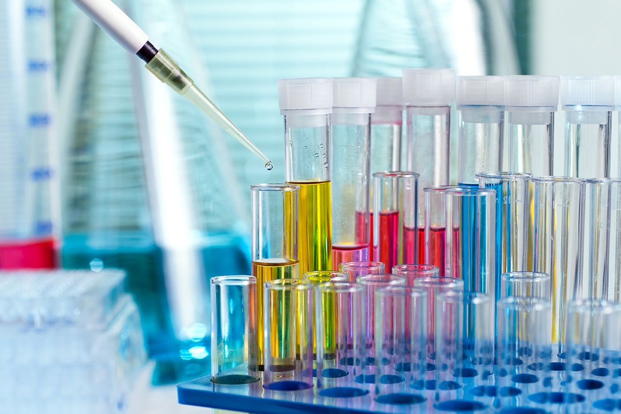 Pipette filling various beakers with fluid