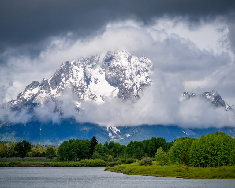 Wyoming’s Mount Moran emerges from thick clouds shortly after a heavy rainstorm, with the Snake River in the foreground. The peak is part of the Teton Range rising around 6,000 feet (1800m). Snowmelt from this area is a major source of water for the five states through which the Snake River passes. Amir AghaKouchak / UCI