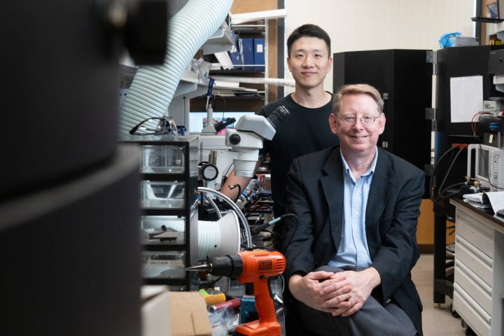 “The combination of these … technological advances and the result of millions of years of the evolution of olfactory receptor proteins is enabling the goal of single-molecule sensing with specificity towards analytes that differ by as little as one carbon atom,” says Peter Burke (sitting), with graduate student Sangjun Noh. Steve Zylius / UC Irvine