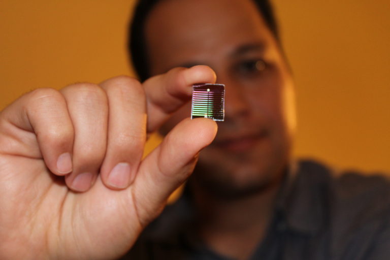 Rahim Esfandyarpour, UCI assistant professor of electrical engineering & computer science, holds up a device that he and colleagues developed for detecting a biomarker for chronic fatigue syndrome, which has been notoriously difficult to diagnose.