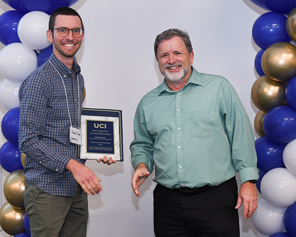 David Copp (left), the Engineering Dean’s Honoree at the 2024 Celebration of Teaching Awards, is congratulated by Vice Provost of Teaching and Learning Michael Dennin.