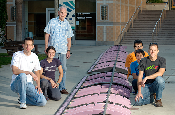 Liebeck, standing, with UCI’s human-powered airplane student team in 2014. Now in 2023, Joe King (first left) is at Northrop Grumman’s Scaled Composites working on the prototype for the BWB scheduled for 2027. Jacqueline Huynh (second left) is now an assistant professor of mechanical and aerospace engineering at UCI and married to Dat Huynh (third from right) who is an engineer at Boeing. Liebeck is an adviser for the UCI Design/Build/Fly Team. Photo: Steve Zylius