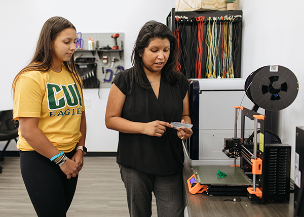 One of Espinosa’s students (pictured left) worked on UCI’s electric racecar design team.