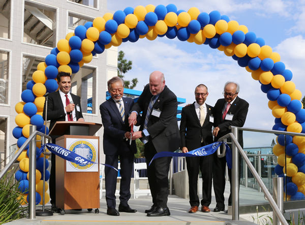 UCI Chancellor Howard Gillman and HORIBA Group Chairman and CEO of HORIBA Ltd. Atsushi Horiba cut a ribbon to formally open the HIMaC2 advanced mobility research center on the UCI campus. They are flanked by (on the left) HIMaC2 Director Vojislav Stamenkovic, UCI professor of chemical and biomolecular engineering; and (on the right) UCI Dean of Engineering Magnus Egerstedt and Jai Hakhu, executive corporate officer for HORIBA Ltd. Lori Brandt / UCI