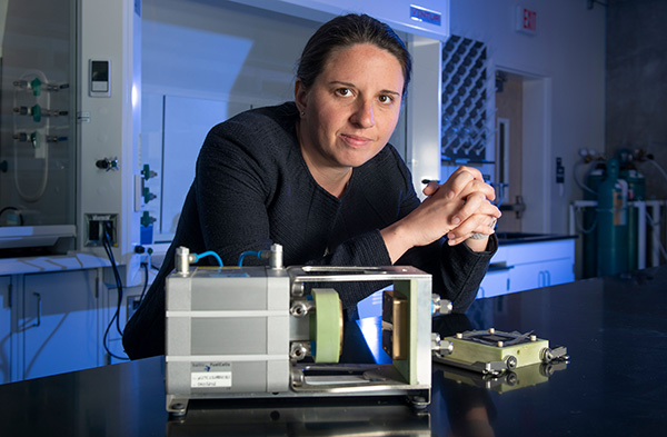 Iryna Zenyuk with fuel-cell hardware and a membrane coated by a catalyst layer at her UCI lab.