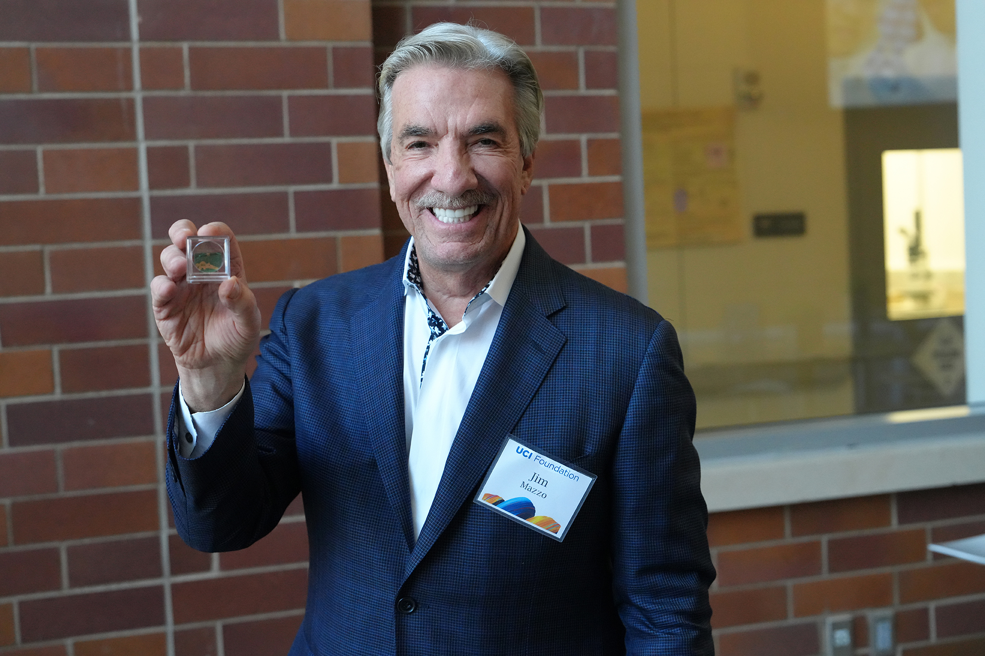 Jim Mazzo shows off a micro-Anteater sensor made in INRF. According to Hung Cao, “This Anteater cannot eat ants but it can sense toxic gases and liquids.”