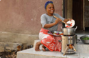 Kenyan woman using an Ecoa Wood cookstove