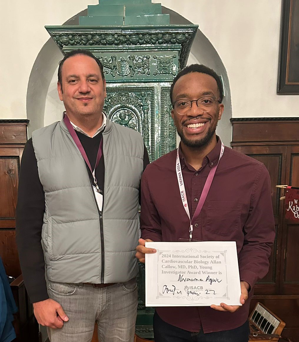 Kheradvar (left) and Agwu pose at the 2024 meeting of the International Society for Applied Cardiovascular Biology in Vienna, where Agwu was honored with the Allan Callow, M.D., Ph.D., Young Investigator Award.