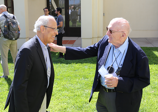 Said Elghobashi (left) catches up with former UCI engineering school dean Allen R. Stubberud.