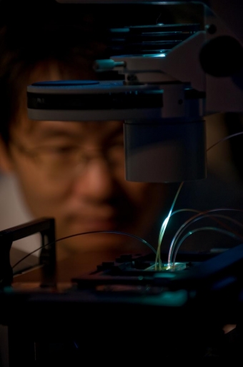 UCI project scientist Don-Ku Kang observes the IC 3D technology, which can rapidly detect bacteria in blood samples.