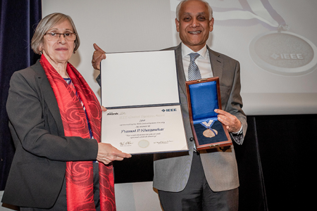 Ljiljana Trajković, professor of engineering at Simon Fraser University, presented the IEEE award to Khargonekar on behalf of the organization's Board of Directors.