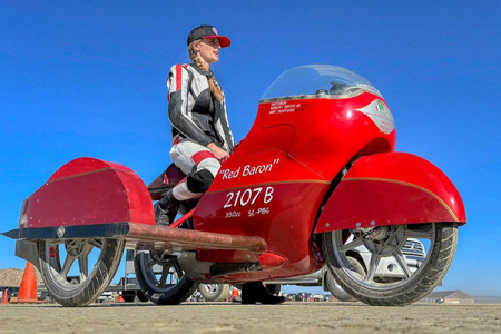 Samueli School alumnae Amy Dunford races the Red Baron, a supercharged 1985 motorcycle, pictured here with additional sidecar added to qualify for new records.