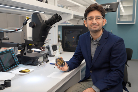 Dion Khodagholy holds neural soft electronics in his UCI lab.