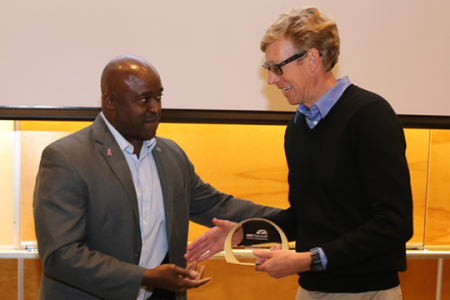 Samueli School Dean Gregory Washington congratulates Innovator of the Year Professor David Reinkensmeyer