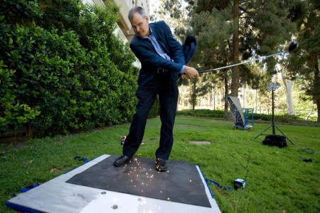 Professor James Earthman demonstrating how titanium clubs can cause golf course fires