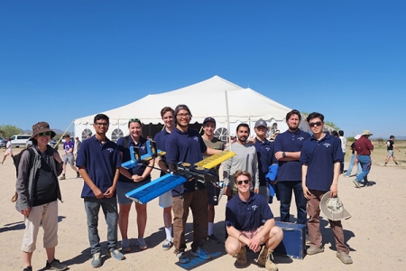 The UCI Design, Build, Fly team completed all three missions at the international competition in Arizona. Pictured, from left, are Assistant Professor Jacqueline Huynh, Rahul Donnaganti, Lucia Benjamin, Linus Fischer, Luis Zamora, Chaz Fazio, Daniel Steiner, Deepak Gupta, Chang Lee, Brandon Hrafnsson, Haoyi "Hardy" Wang. Not pictured: Eric Cheng, Jerome Masicat, Minas Minasyan, Parker Hemmings, Raymond Dunn. 