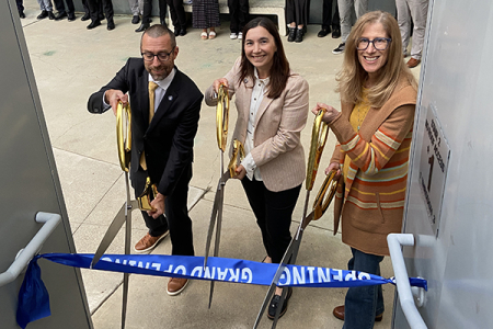 From left, UCI Engineering Dean Magnus Egerstedt, OAI Executive Director Analia Rao and UCI Foundation trustee Stacey Nicholas cut the ribbon at the stairway that leads to the renovated Stacey Nicholas Office of Outreach, Access and Inclusion.