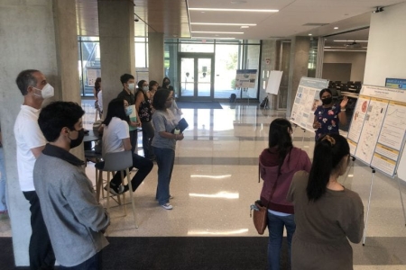 Undergraduate students in the Samueli Interdisciplinary Research in Pods program gather in the lobby of UCI’s Interdisciplinary Science and Engineering Building for a poster session to discuss their summer research projects. Brett Sanders / UCI