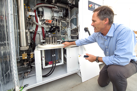Jack Brouwer, UCI associate professor of mechanical & aerospace engineering and civil & environmental engineering, explains the workings of an electrolyzer, a key component of the power-to-gas system. The device uses renewable electricity to split water i