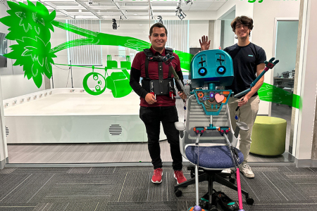 Computer science and engineering student Ervin Grimaldi ’25 and postdoctoral researcher Efraín Méndez with Jean Luc at the UCI Robot Ecology Lab 