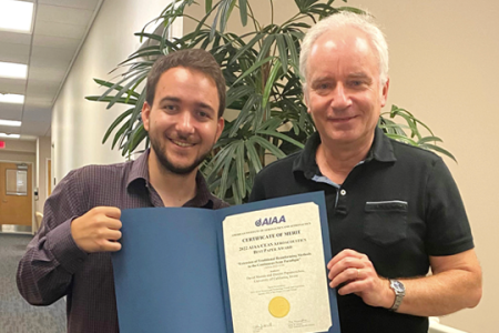 Recent mechanical and aerospace engineering alumnus David Morata (left) and his mentor Professor Dimitri Papamoschou celebrate their AIAA Best Paper Award.