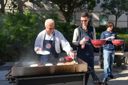 UCI Samueli School of Engineering Interim Dean Faryar Jabbari and Associate Professor David Copp serve pancakes at the Dean’s Breakfast.  