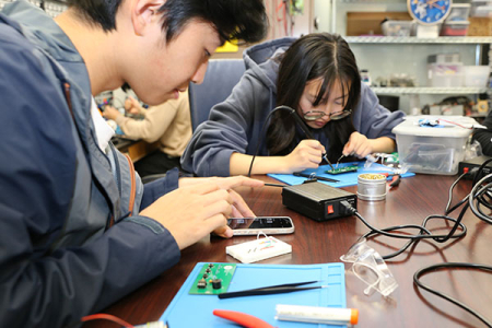 Adam Wu (left) was looking for hands-on experience with computer hardware and found it with the Open Project Space course. 