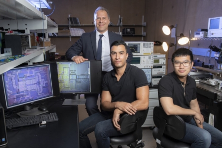 The potentially revolutionary wireless transceiver – which can operate in a frequency range over 100 gigahertz – was developed by (from left) Payam Heydari, director of UCI’s Nanoscale Communication Integrated Circuits Labs and professor of electrical engineering & computer science; and lab members Hossein Mohammadnezhad, who earned a Ph.D. in electrical engineering & computer science this year, and Huan Wang, a doctoral student in the same department. Steve Zylius / UCI