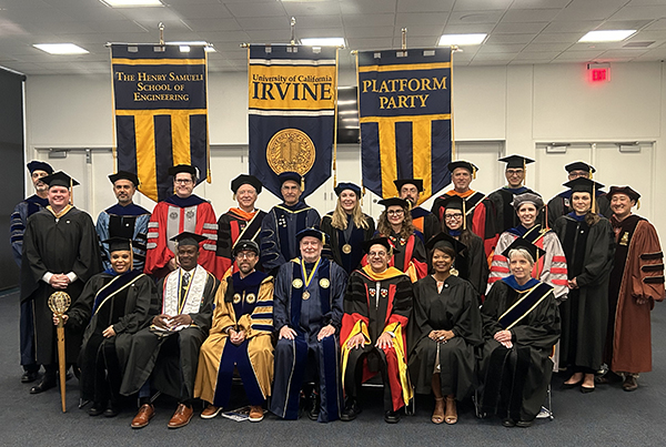 The Samueli School of Engineering 2023 Commencement platform party featured various engineering faculty surrounding presenters pictured, front row from left: Tasha Higgins ‘93, Wezam Paully-Umeh, Magnus Egerstedt, Howard Gillman, Hal Stern, Cynthia Guidry ‘92 and Nancy Da Silva.