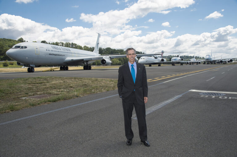 “In my work at Boeing, I saw firsthand how a kid from an underserved community can dramatically change the life of an entire family overnight when they get their first paycheck in a technology field,” says John Tracy, Ph.D. ’87, shown here at the aerospace giant’s 2016 centennial celebration in Seattle. Courtesy of John Tracy