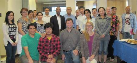 Tiantian Yang (second from bottom left) poses for a group photo with his Center for Hydrometeorology and Remote Sensing (CHRS) peers and then UC Irvine Chancellor Michael Drake in 2012. 