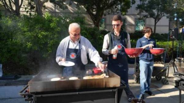 UCI Samueli School of Engineering Interim Dean Faryar Jabbari and Associate Professor David Copp serve pancakes at the Dean's Breakfast.