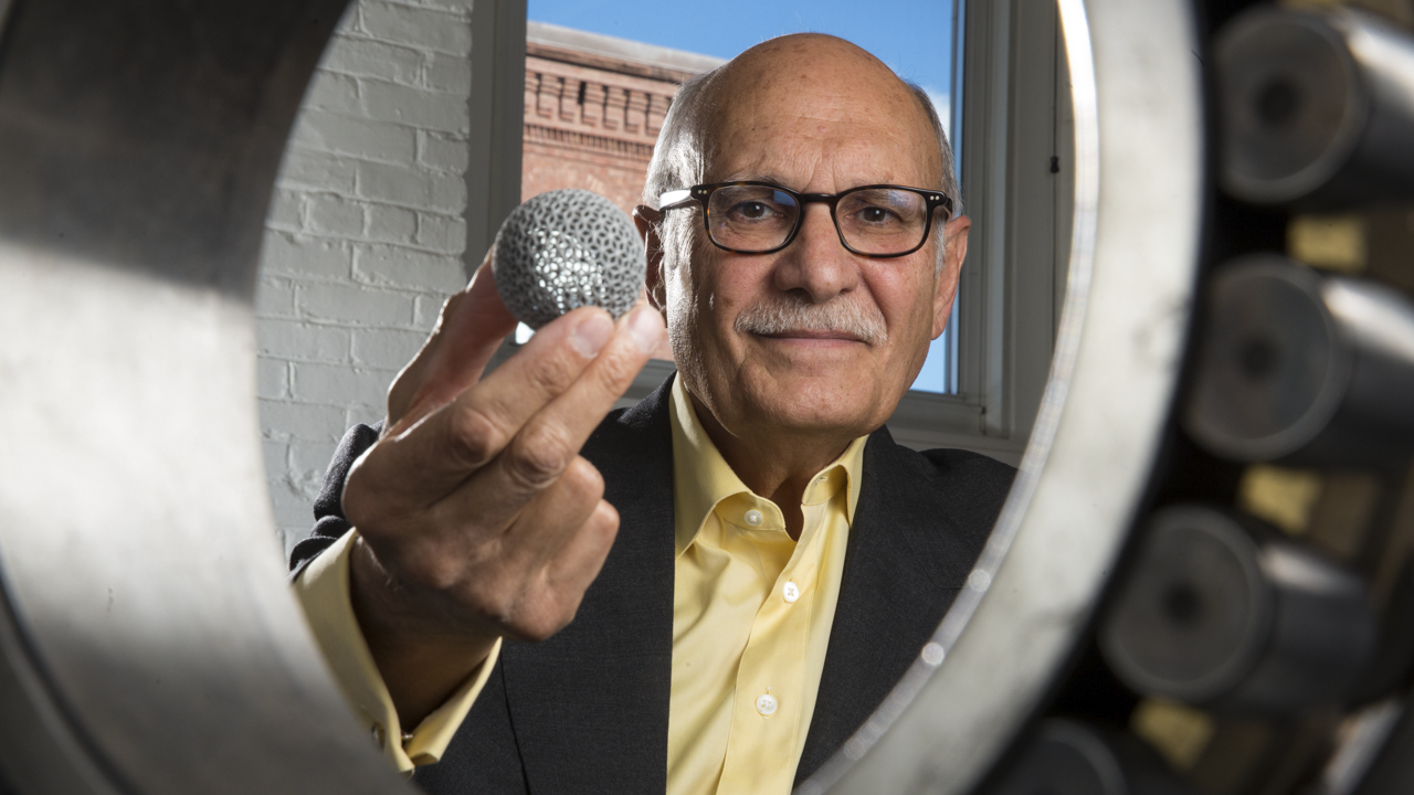 Man holding spherical device